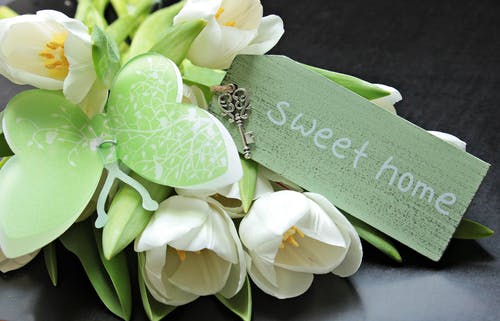 Services Picture: White flowers witha green sweet home message